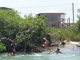 Kids playing in the lagoon in Ambergris Caye, Belize – Best Places In The World To Retire – International Living